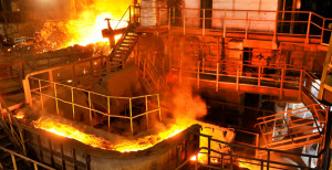 Steel Mill shown in production with hot molten metal moving across the scene, industrial brake system are used extensively here.