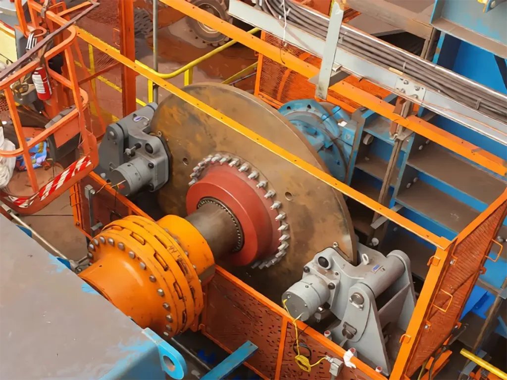 Conveyor drive shaft with coupling and brake
