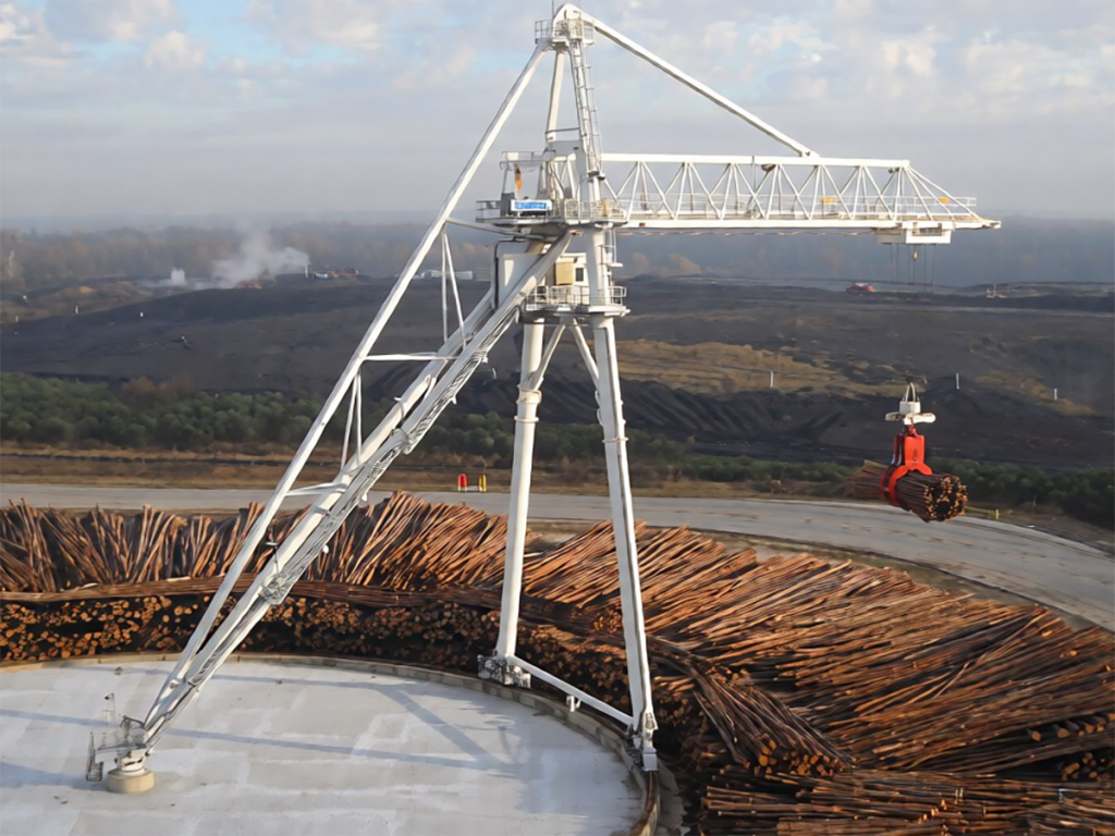Gantry crane over a log storage yard at a sawmill
