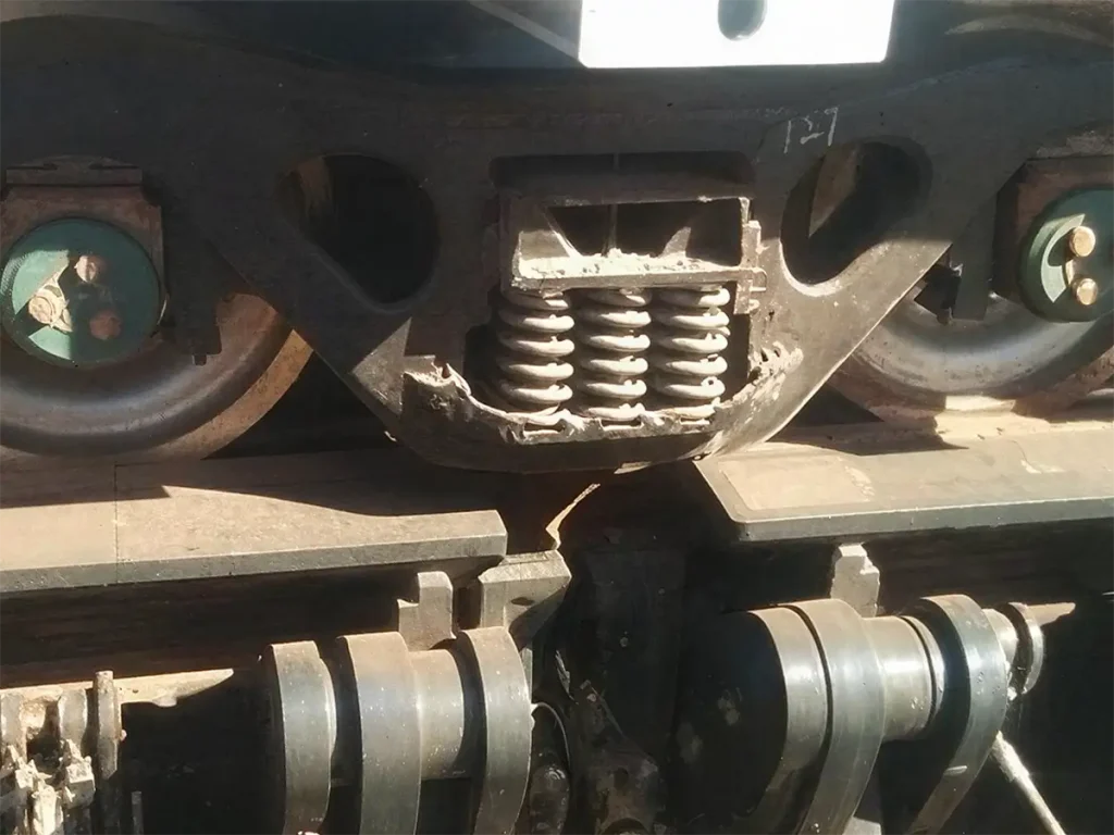 Close-up of a rail clamp gripping a crane rail